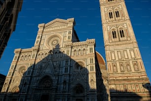 a very tall cathedral with a clock on it's side