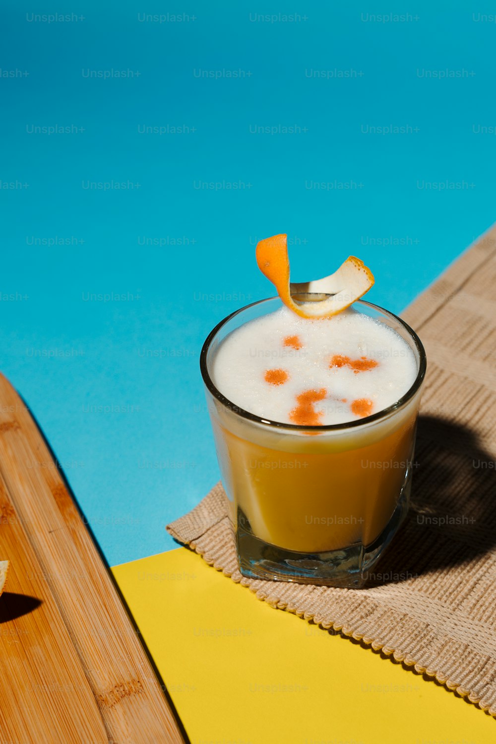 a drink with a slice of orange on top of it