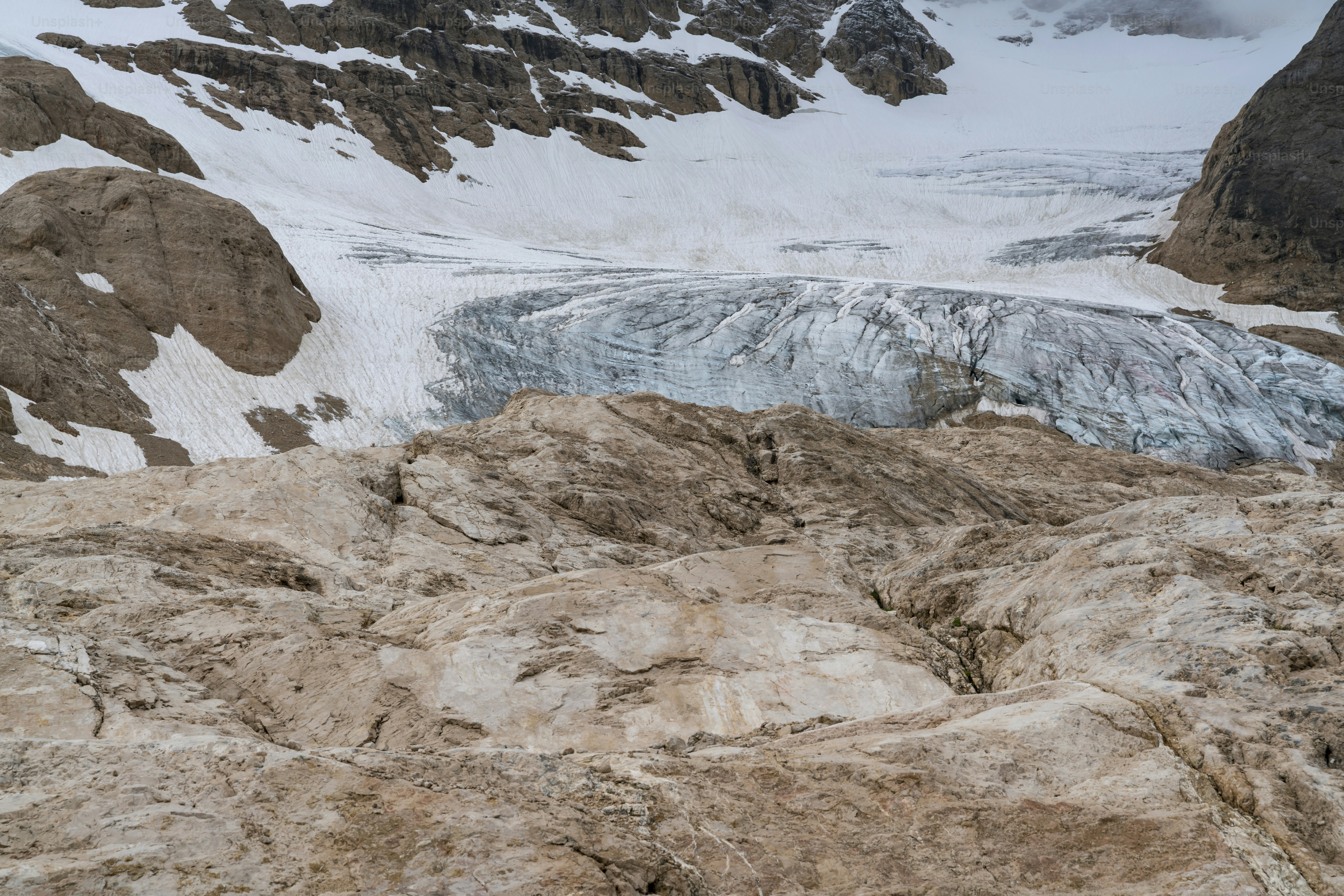 a mountain with a glacier in the background