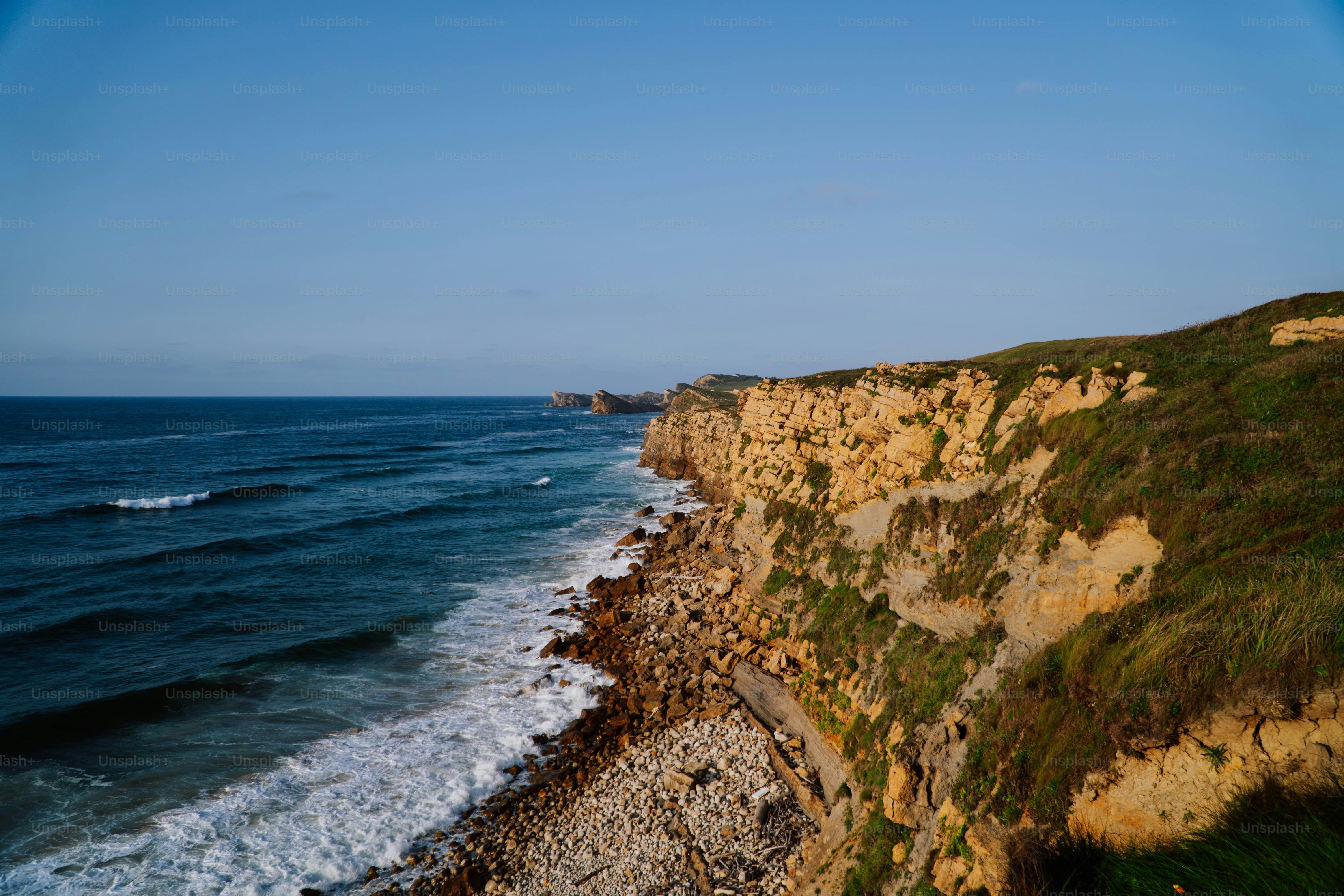 a view of the ocean from the top of a cliff