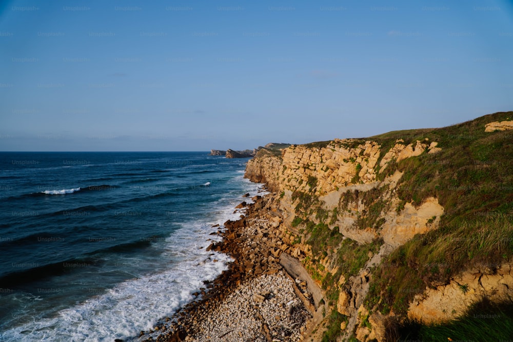 a view of the ocean from the top of a cliff