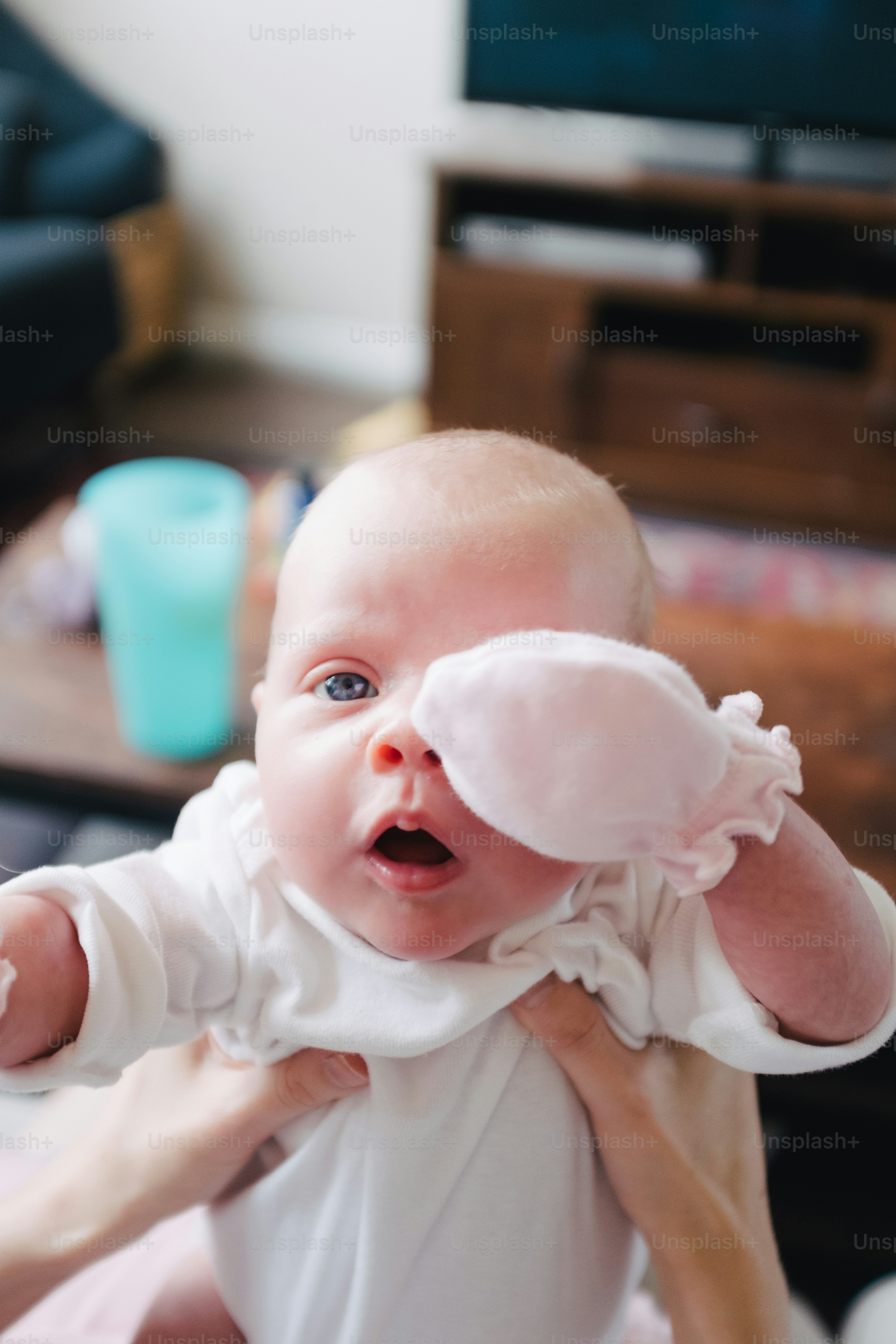a woman holding a baby in her arms
