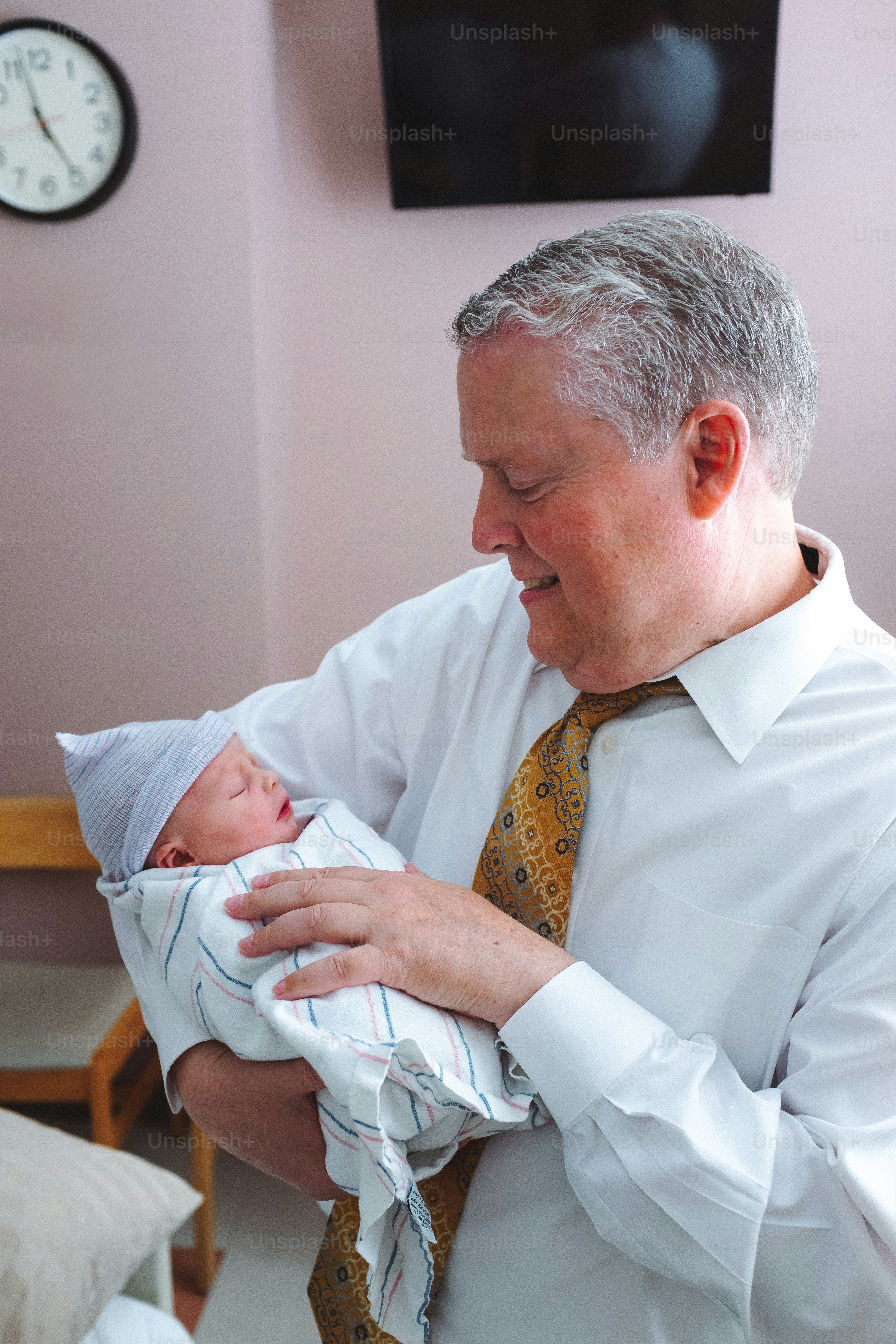 a man holding a baby in his arms