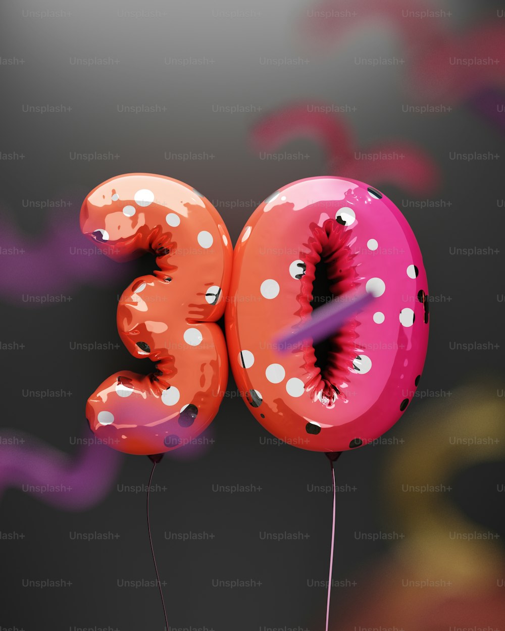 a pink and red balloon shaped like a number three