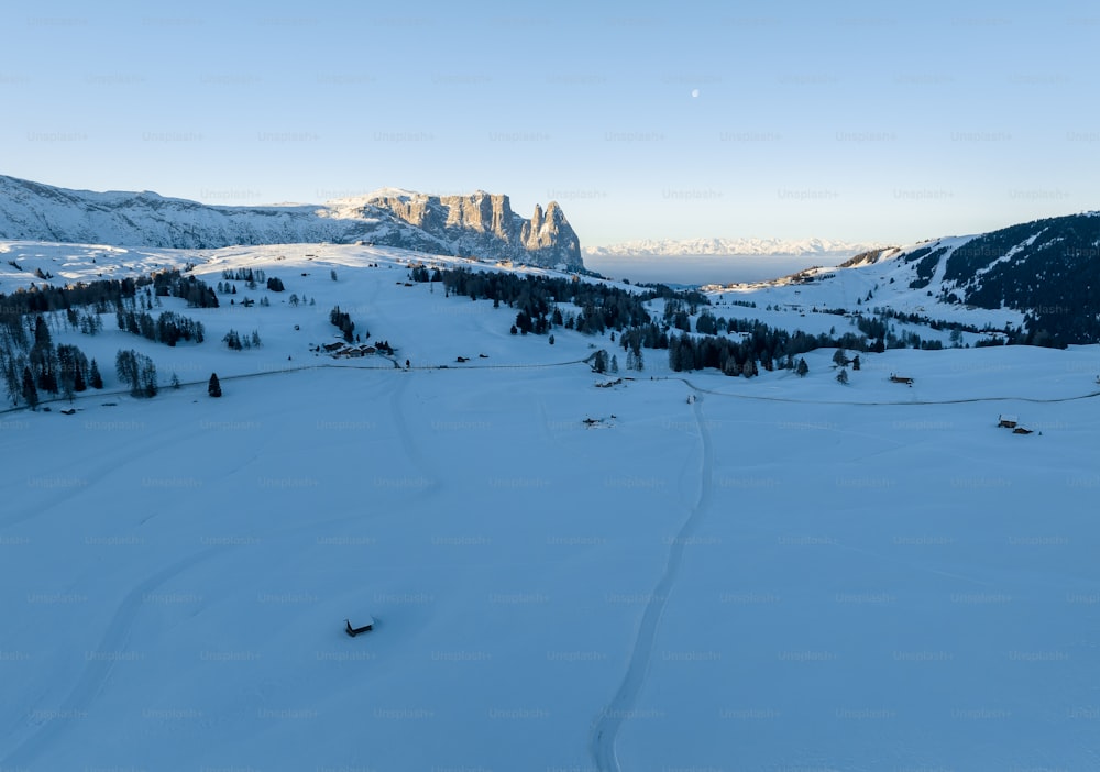 a view of a ski slope with a mountain in the background