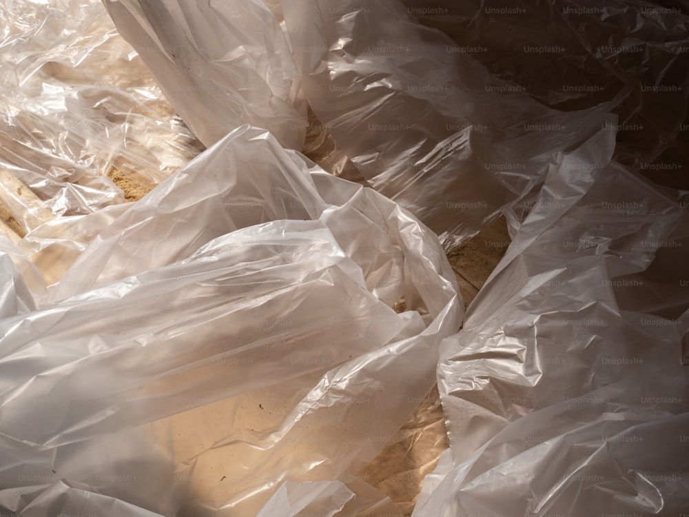 a pile of plastic bags sitting on top of a table
