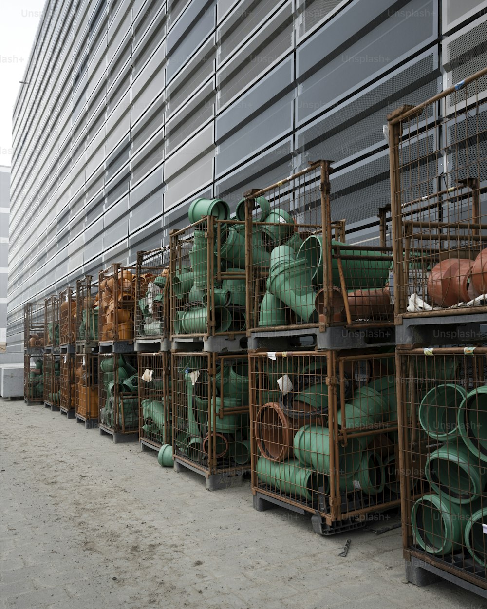 a row of green pipes sitting next to each other