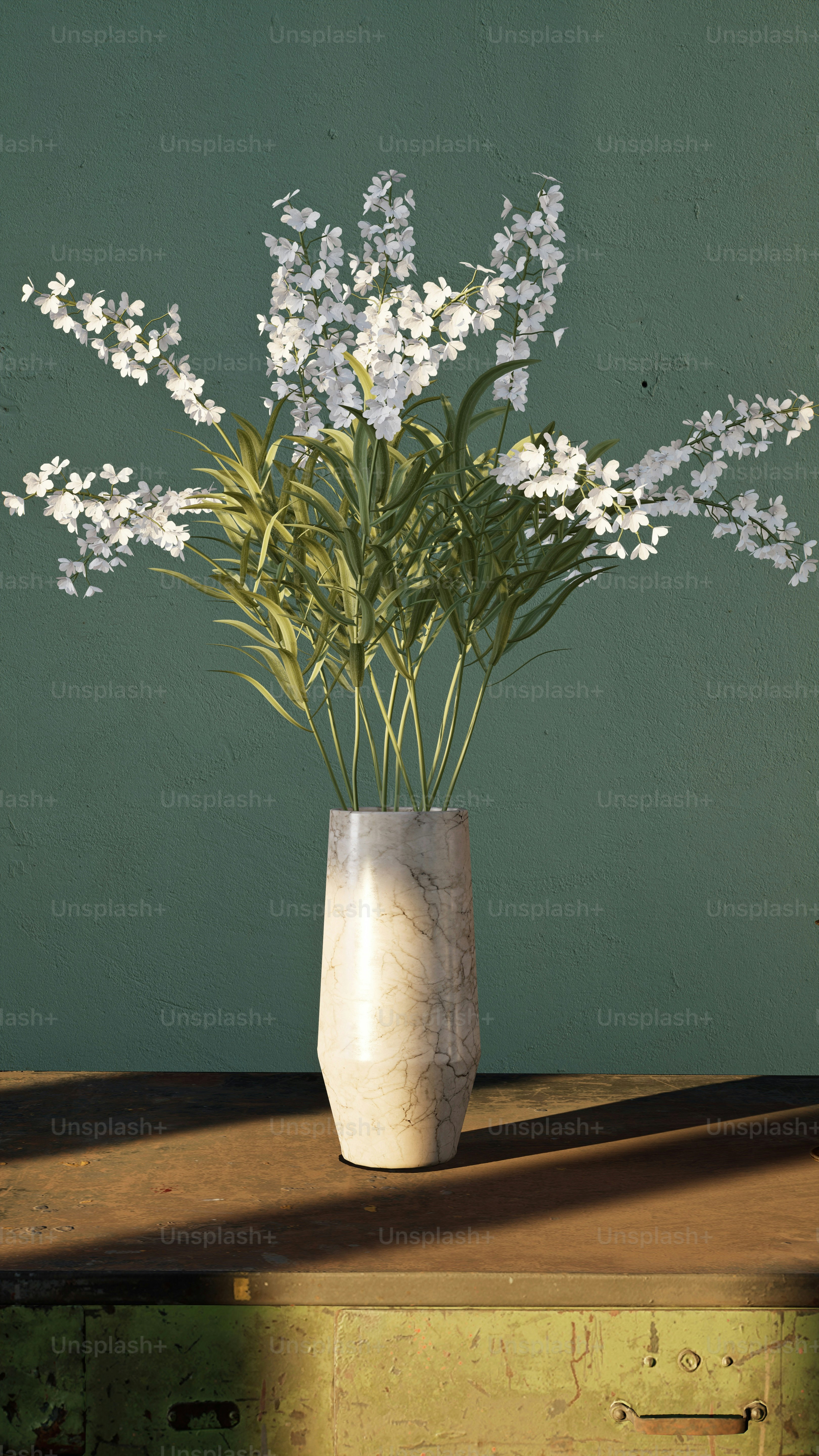 A vase filled with white flowers on top of a wooden table photo ...