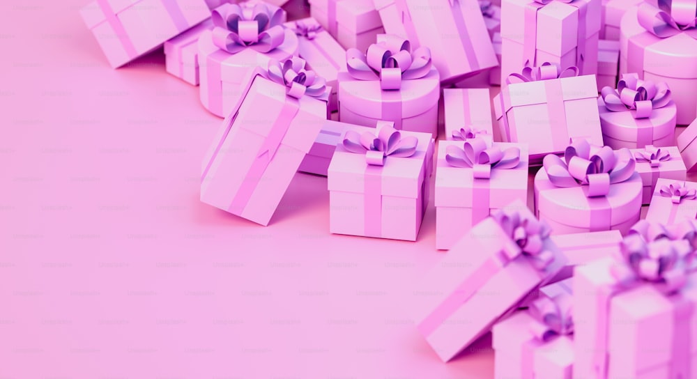 une pile de cadeaux enveloppés de rose sur fond rose