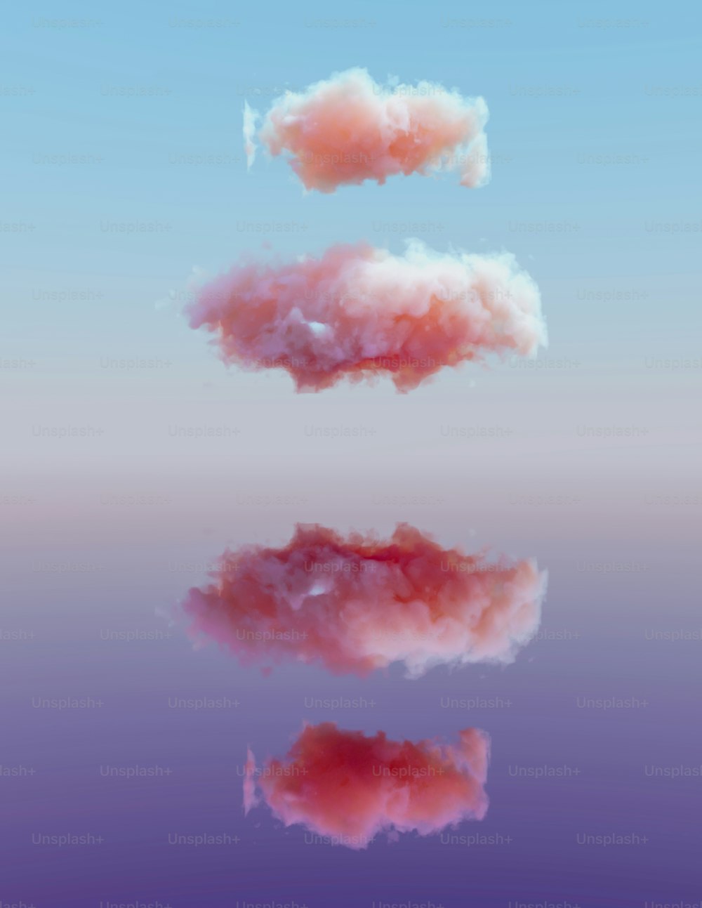 a group of pink clouds floating in the sky