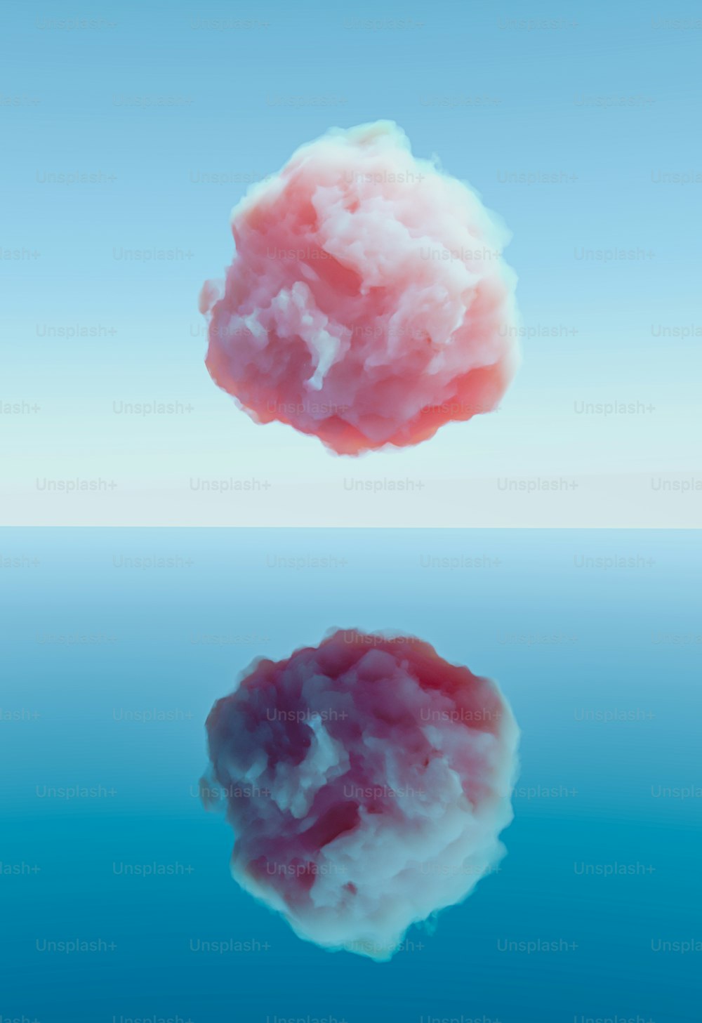 물 위에 공중에 떠 있는 분홍색 구름
