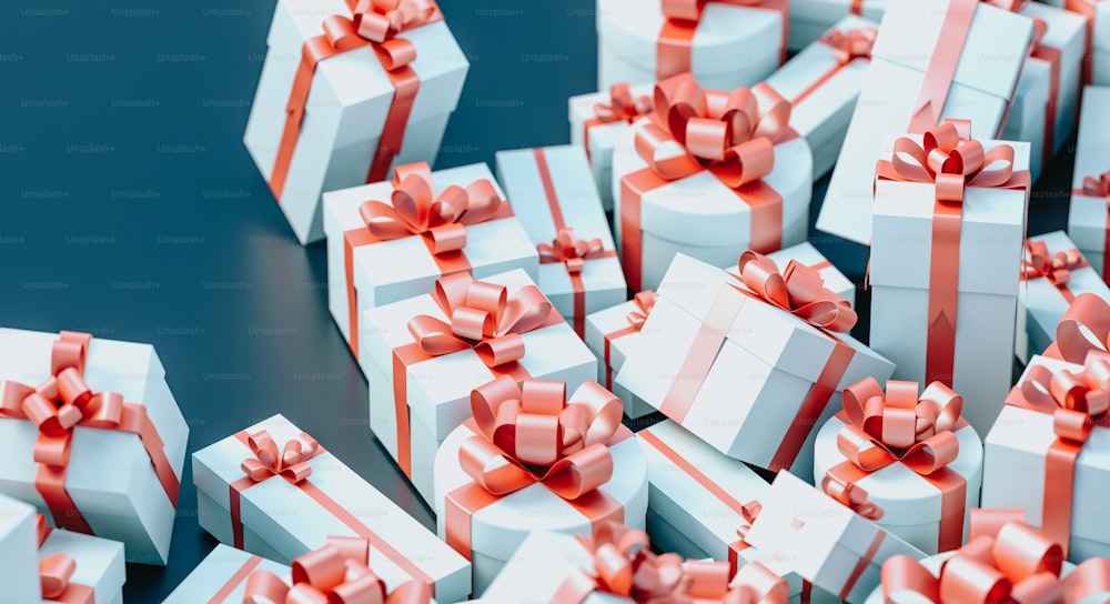 a pile of white and red wrapped gift boxes