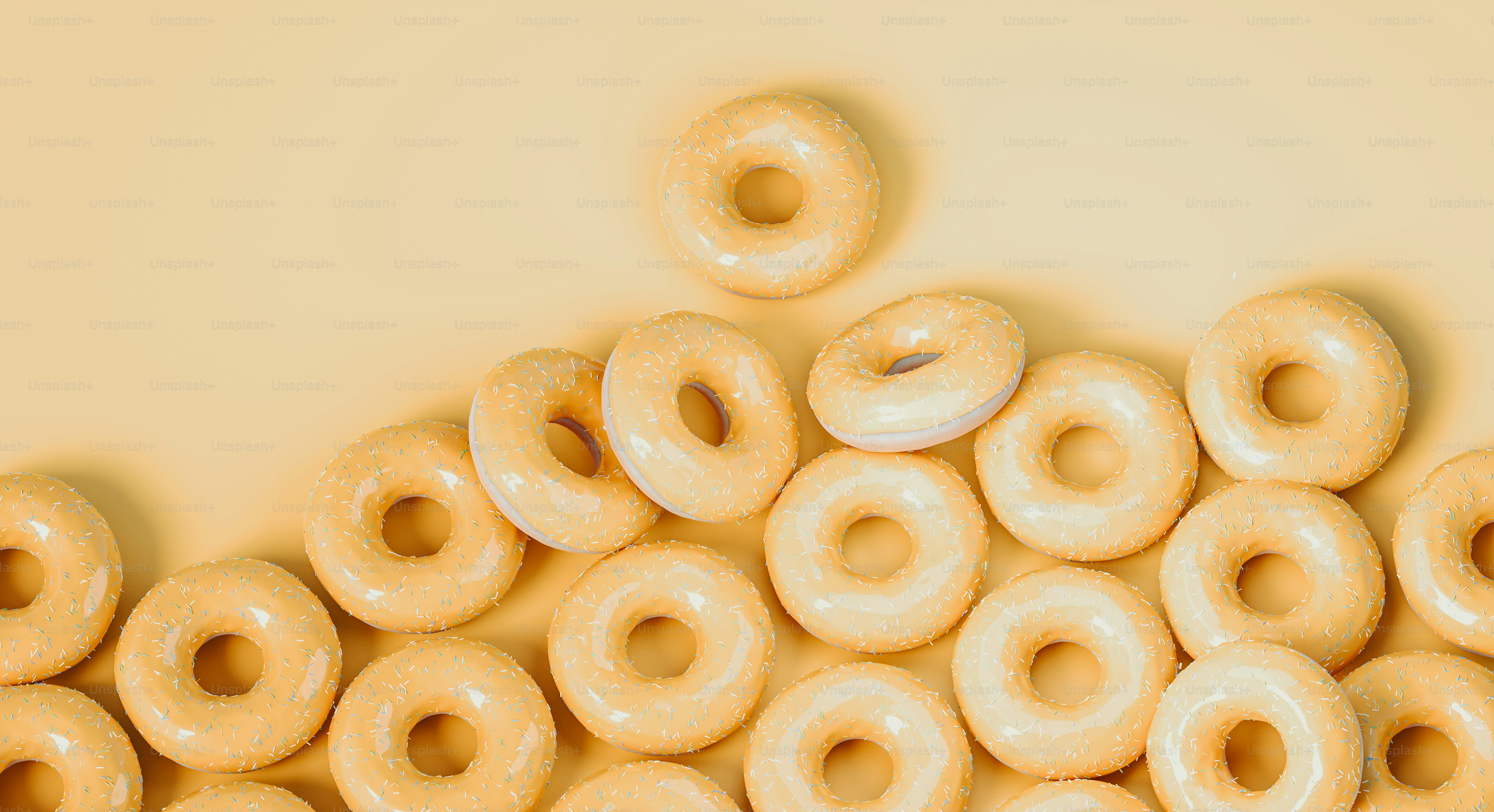 a pile of glazed donuts sitting on top of each other