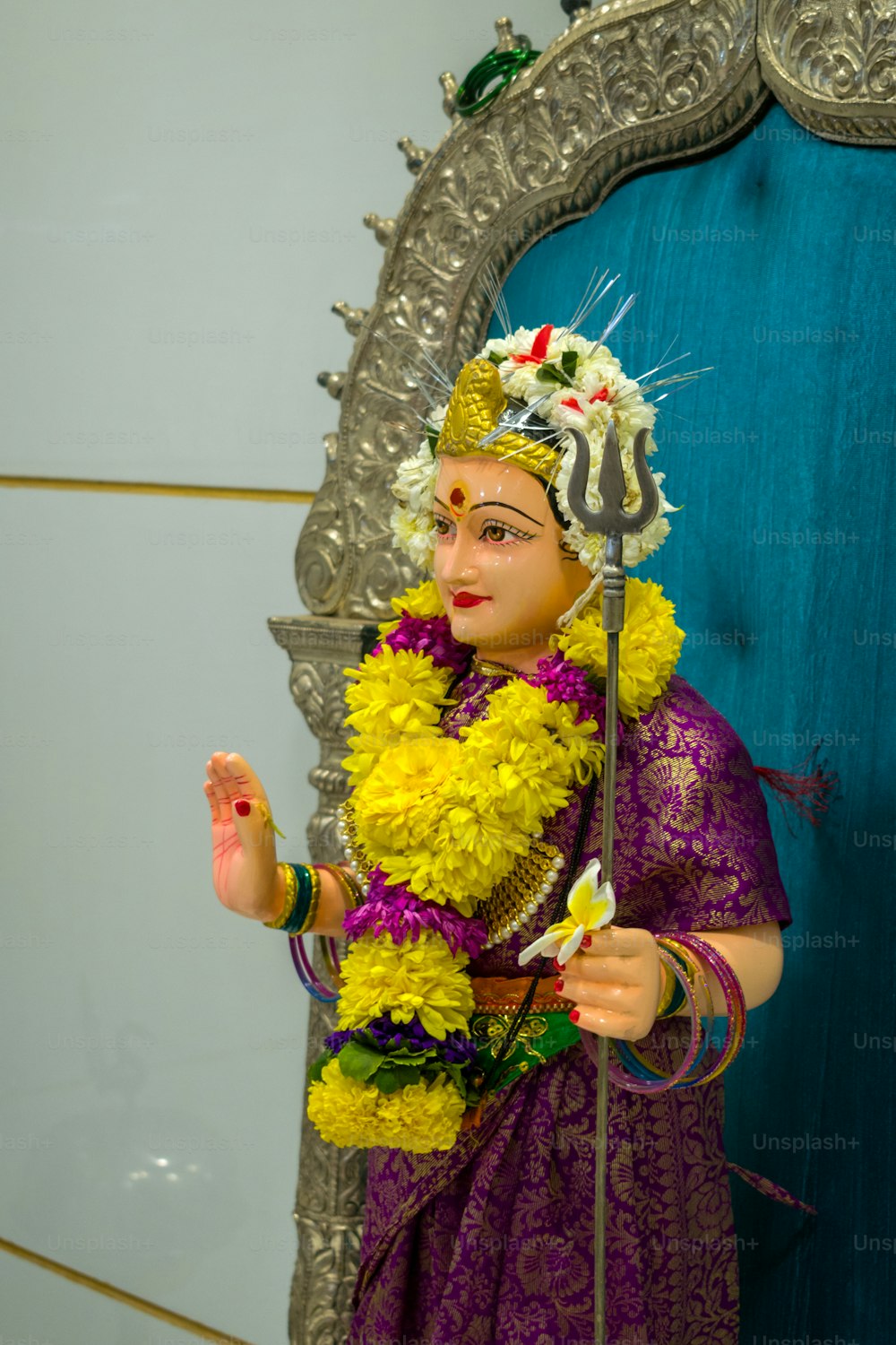 a statue of a woman in a purple dress