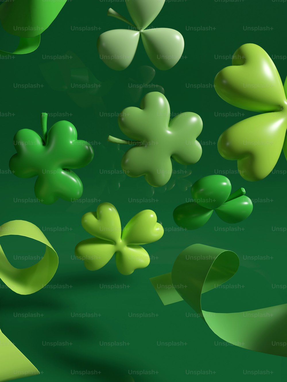 a bunch of green shamrocks floating in the air
