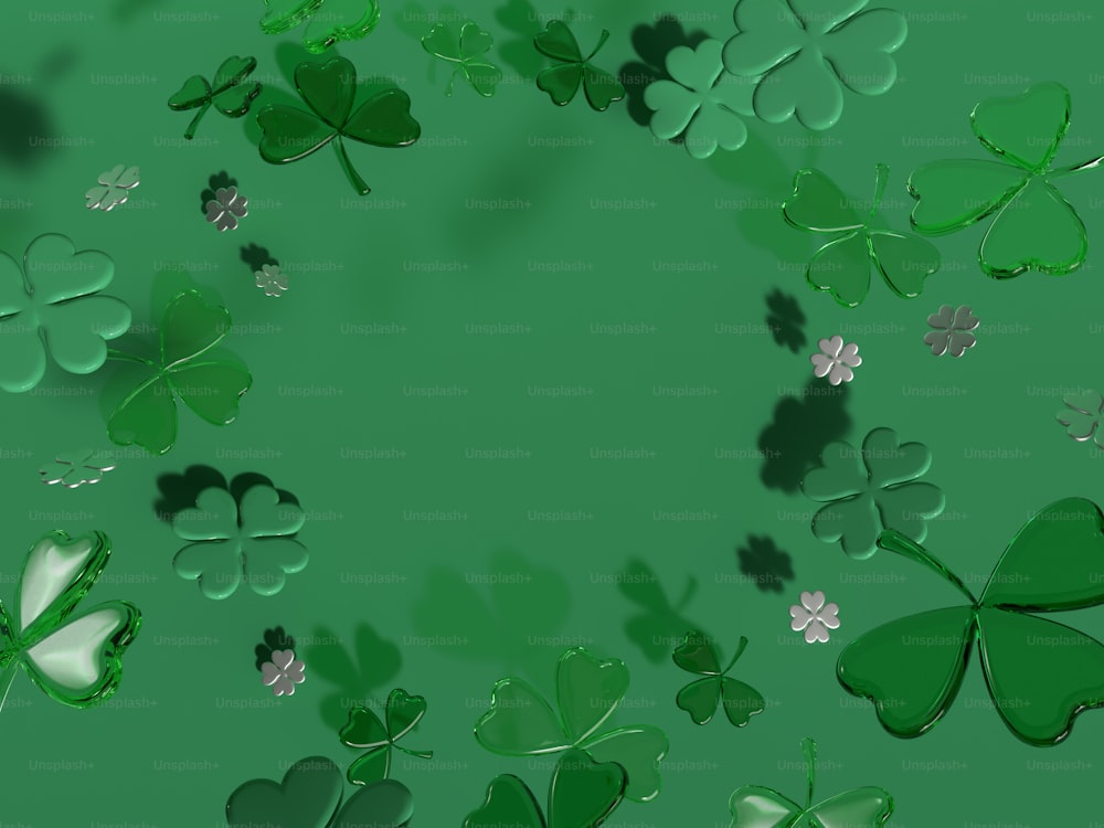 a bunch of green shamrocks are flying in the air