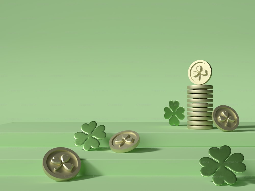 a stack of coins sitting next to a four leaf clover
