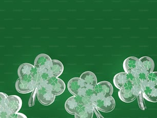 Eine Gruppe von vierblättrigen Kleeblättern auf grünem Hintergrund