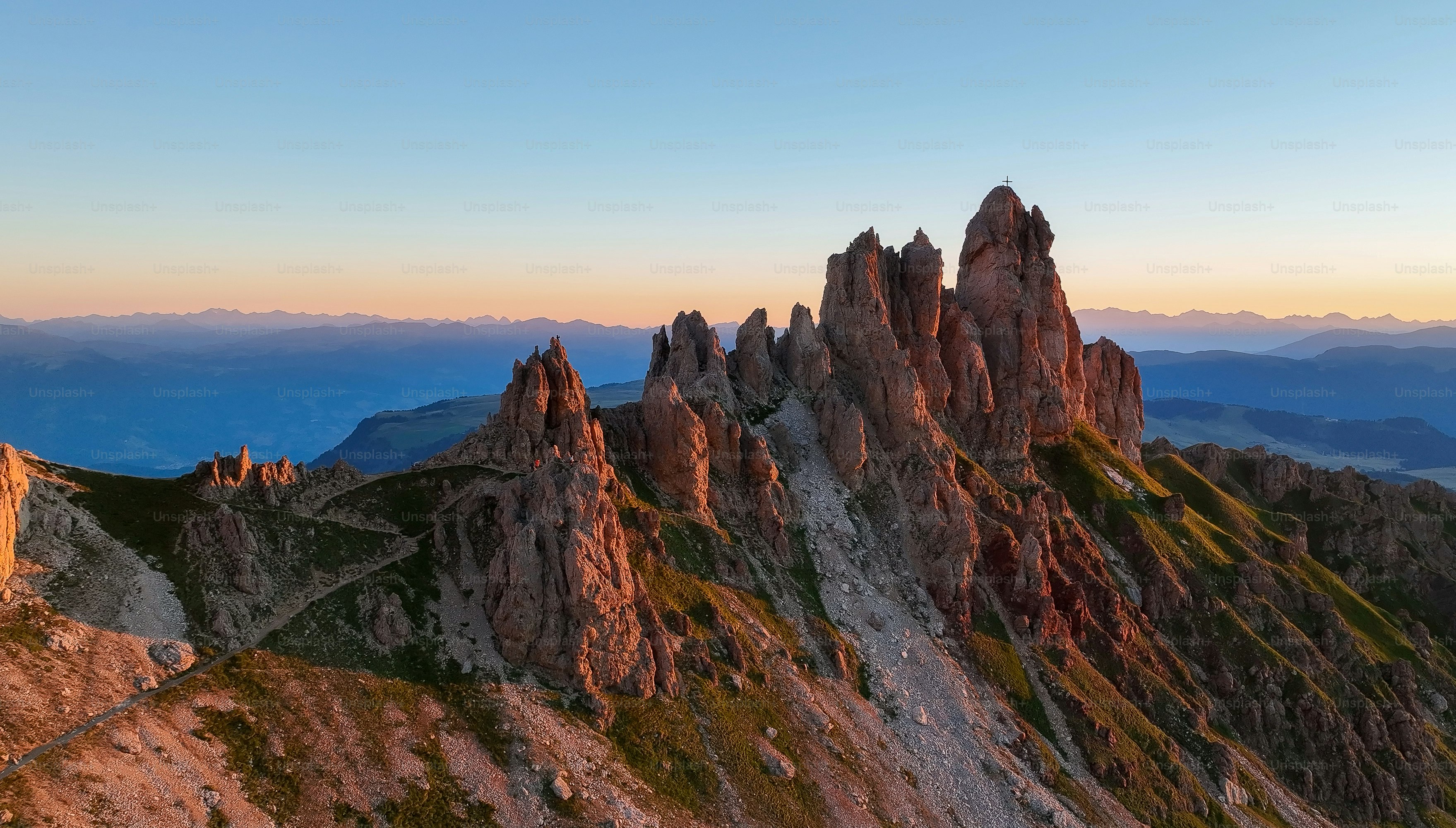 a group of mountains with a sky background
