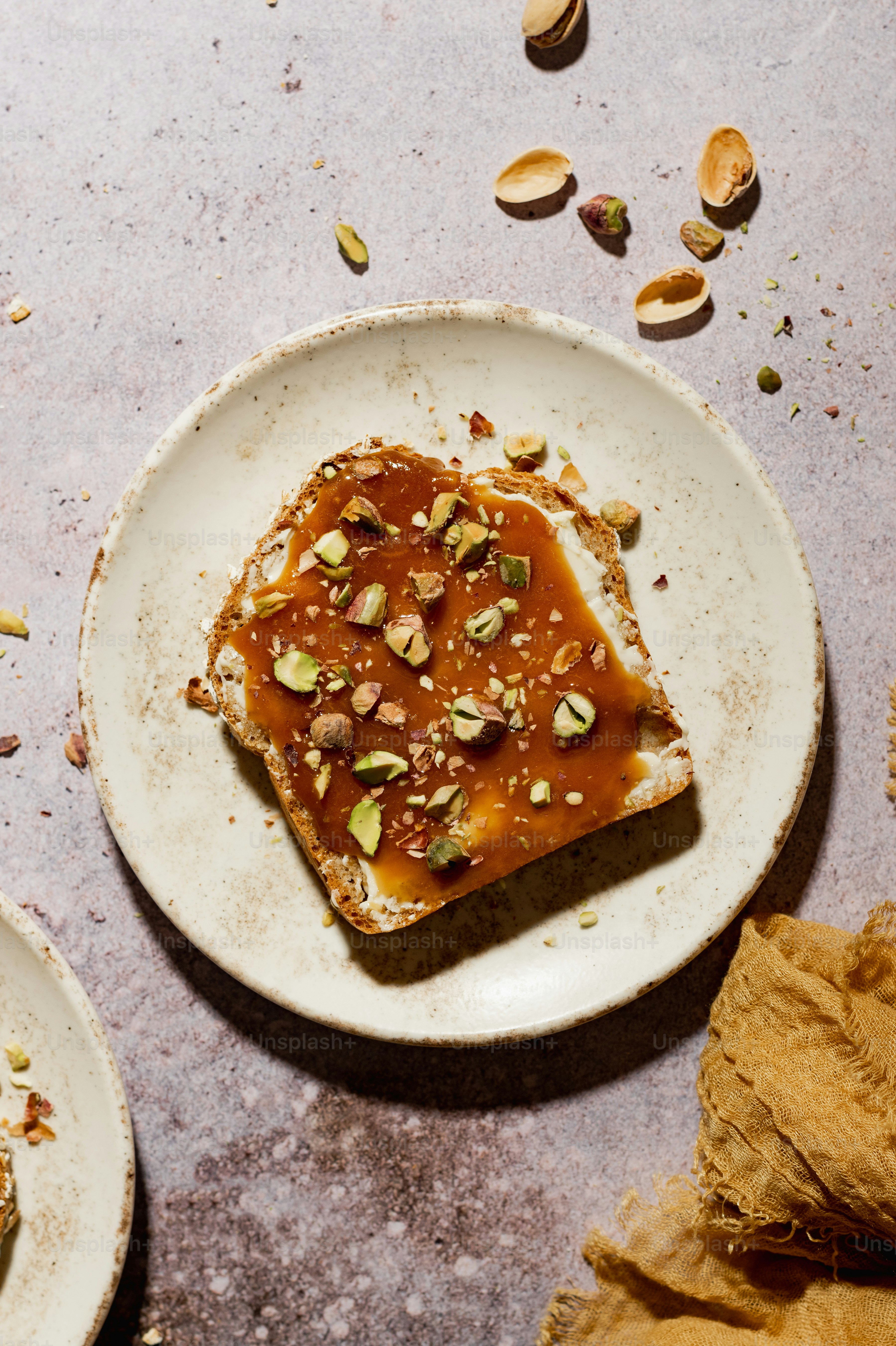 a piece of toast with nuts on top of it