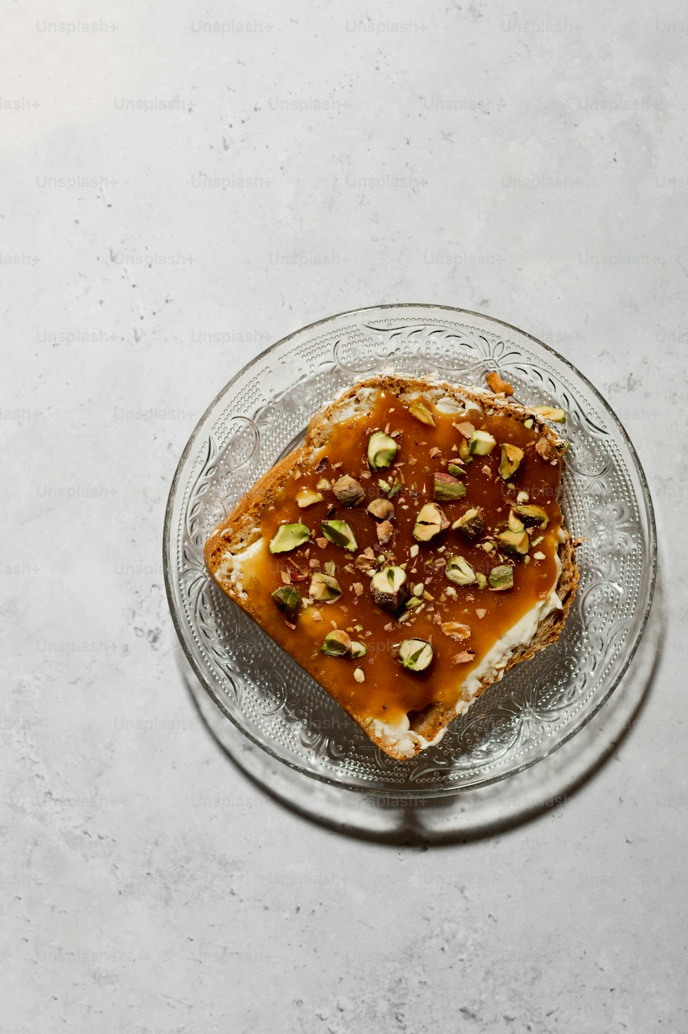 a piece of toast with nuts on top of it