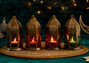 a group of lit candles sitting on top of a table