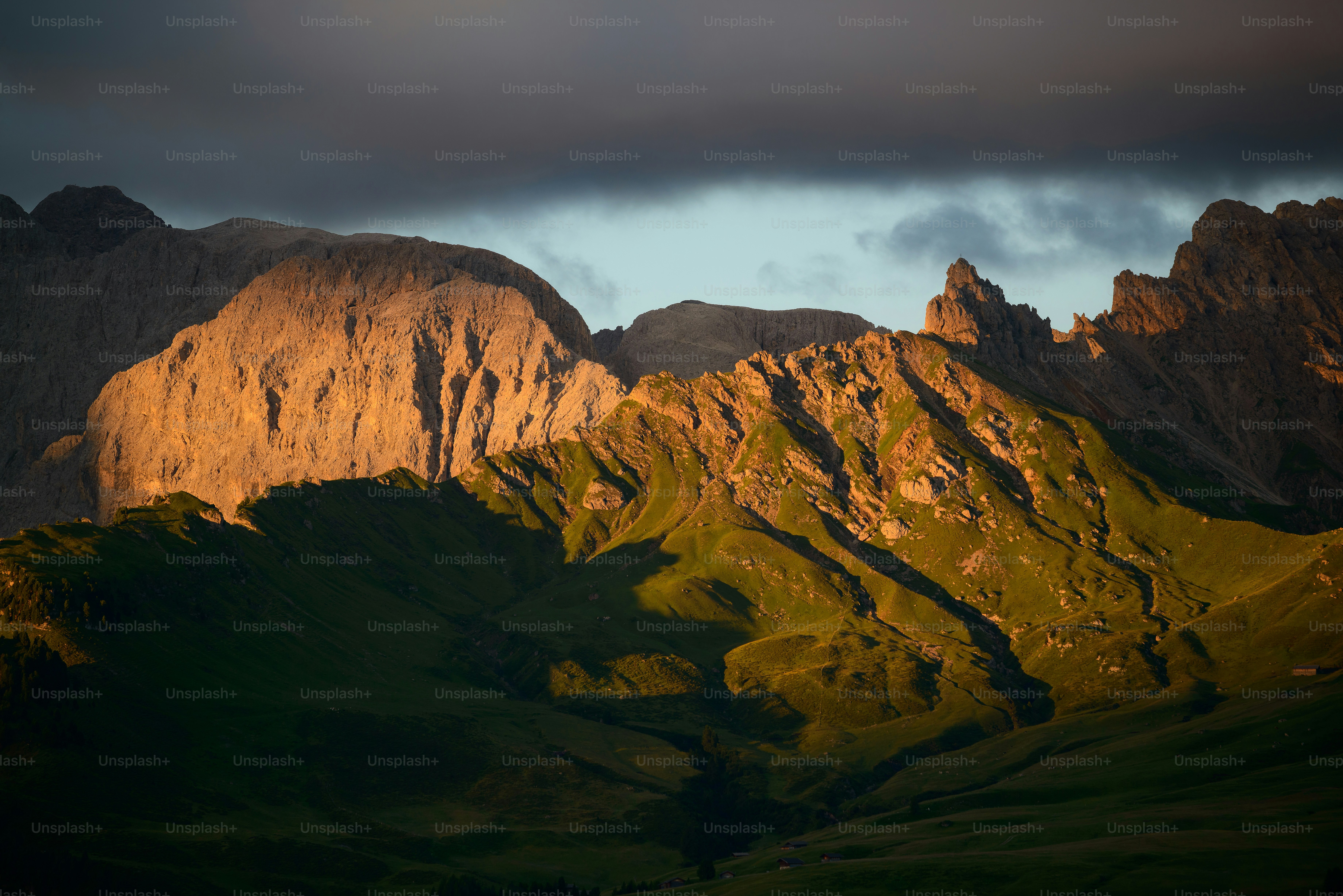 the sun is shining on a mountain range