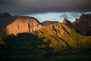 the sun is shining on a mountain range