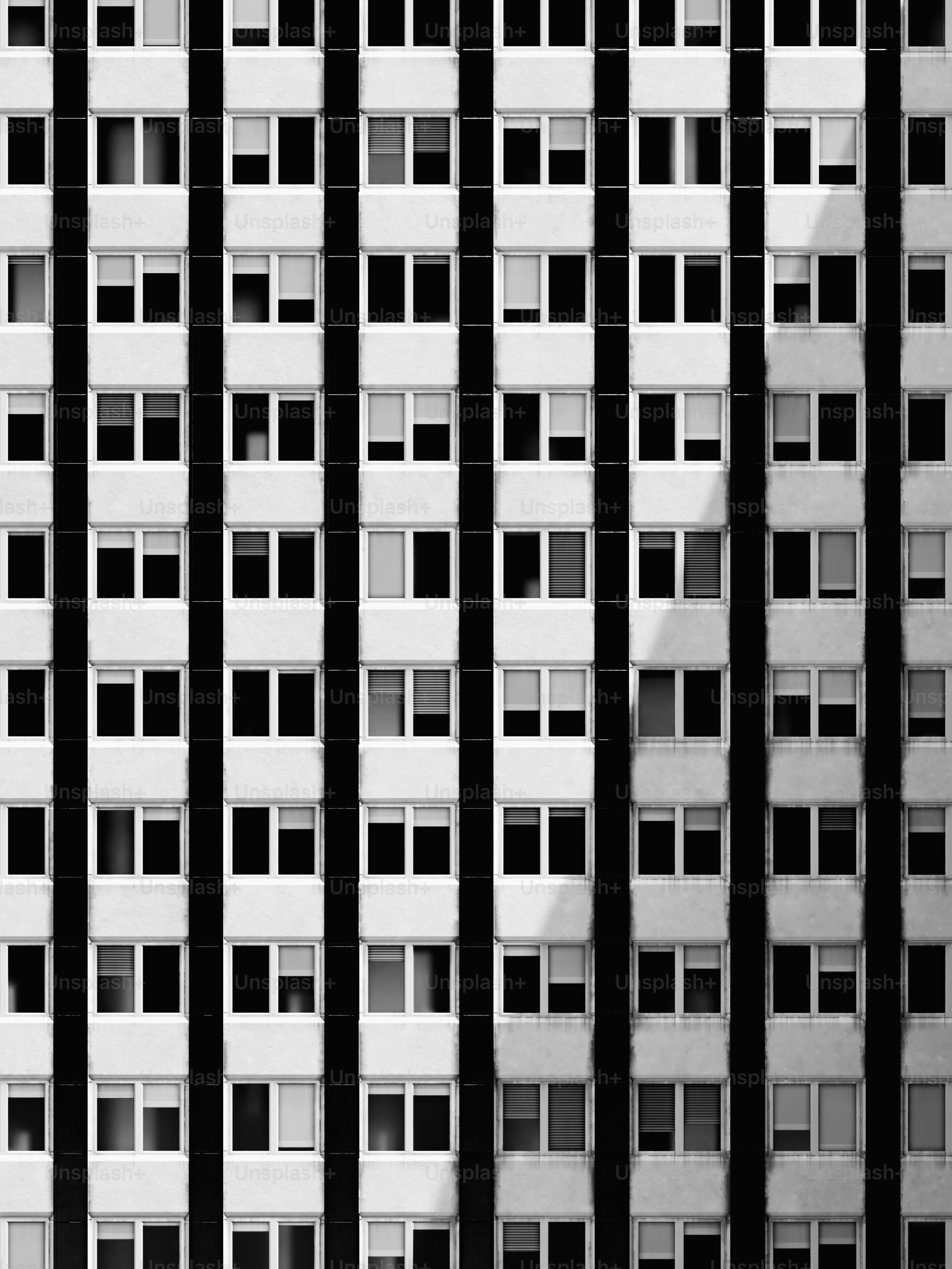 A black and white photo of a tall building photo – City building Image