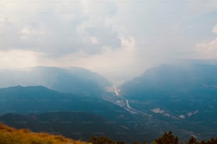 a view of a valley with a river running through it