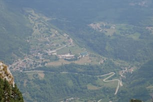 a view of a valley and a road from the top of a mountain