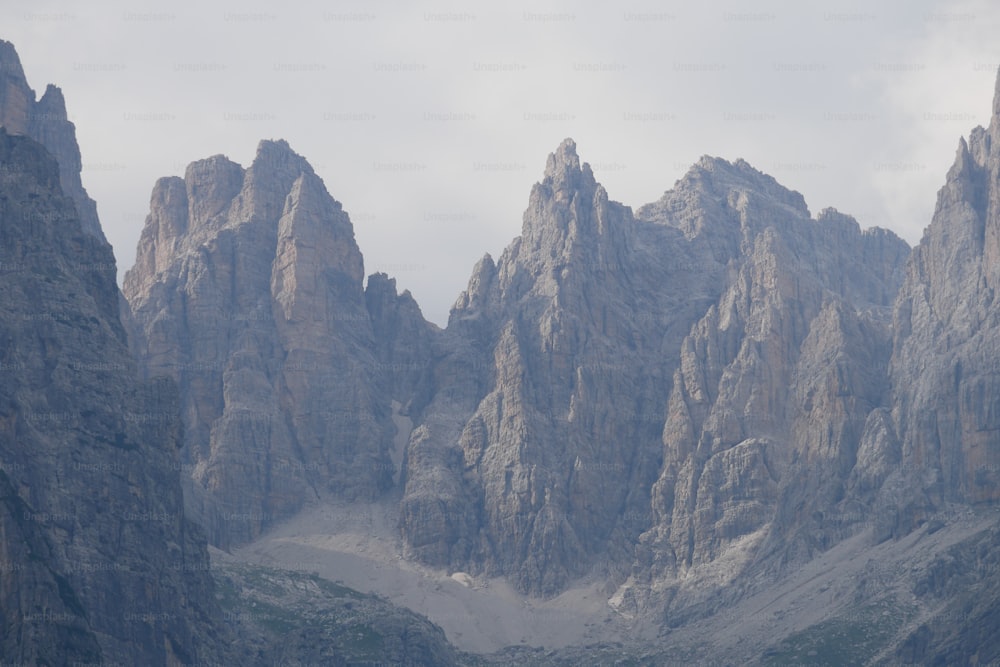 a group of mountains with a sky background