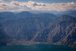 a view of a mountain range with a body of water in the foreground