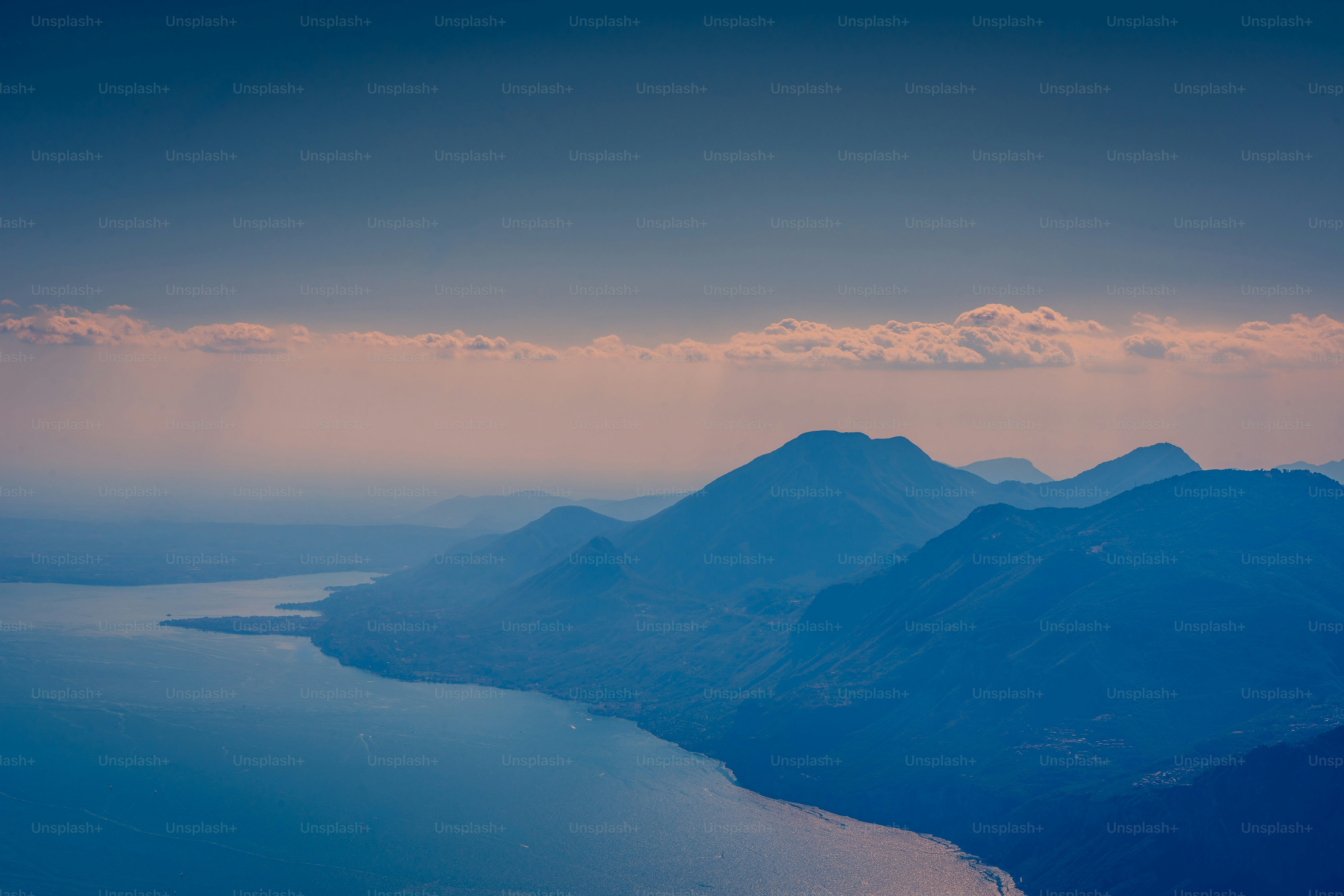a view of mountains and a body of water