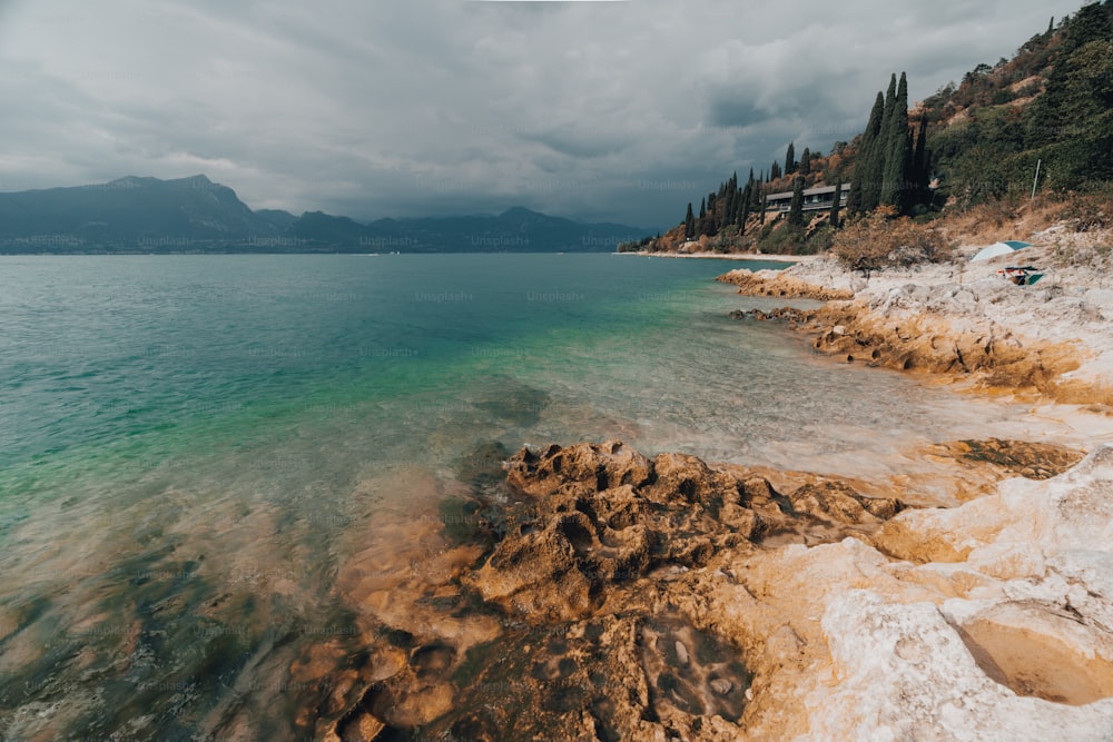 a body of water surrounded by rocky shore