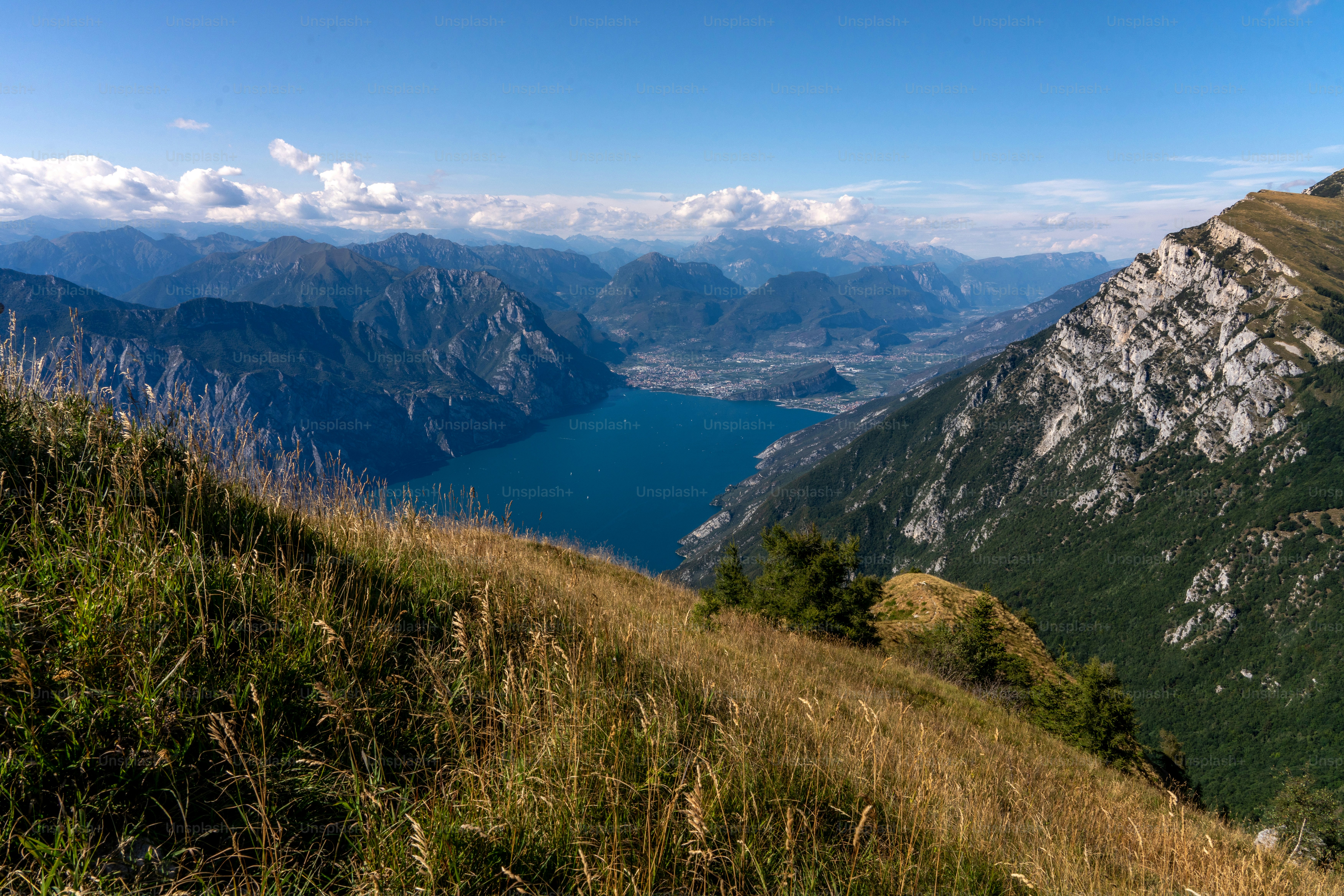 a view of a mountain range with a body of water in the distance