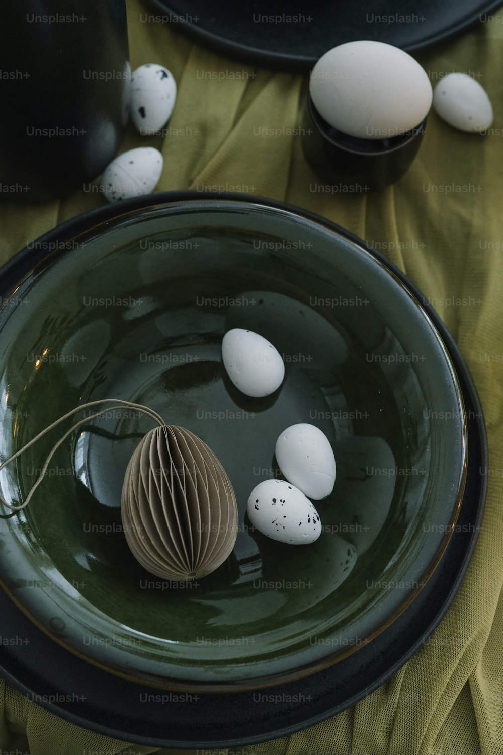 a bowl filled with eggs sitting on top of a table