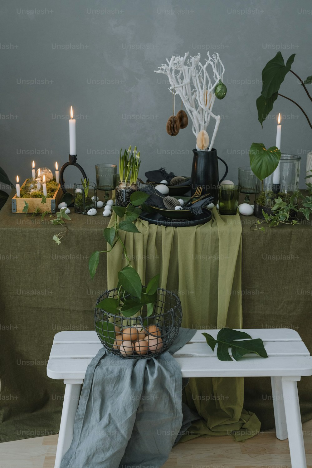 a table topped with a basket of eggs