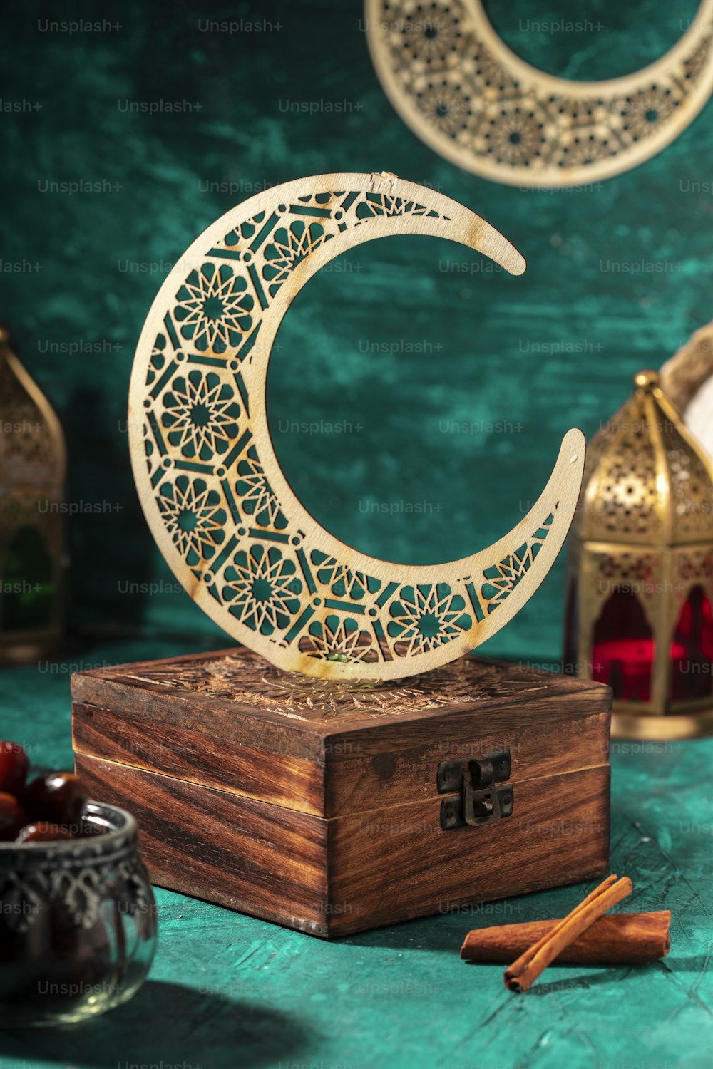 a wooden box with a carved crescent on top of it