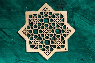 an intricate wooden design on a green background