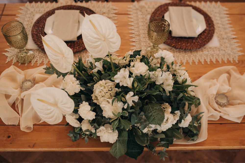 a bouquet of flowers sitting on top of a wooden table