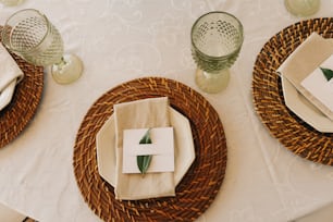 a table set with place settings and napkins