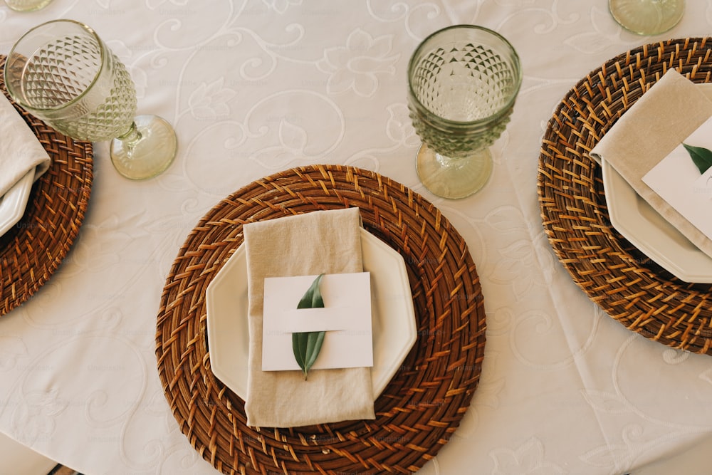 a table set with place settings and napkins