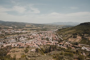 an aerial view of a city in the mountains