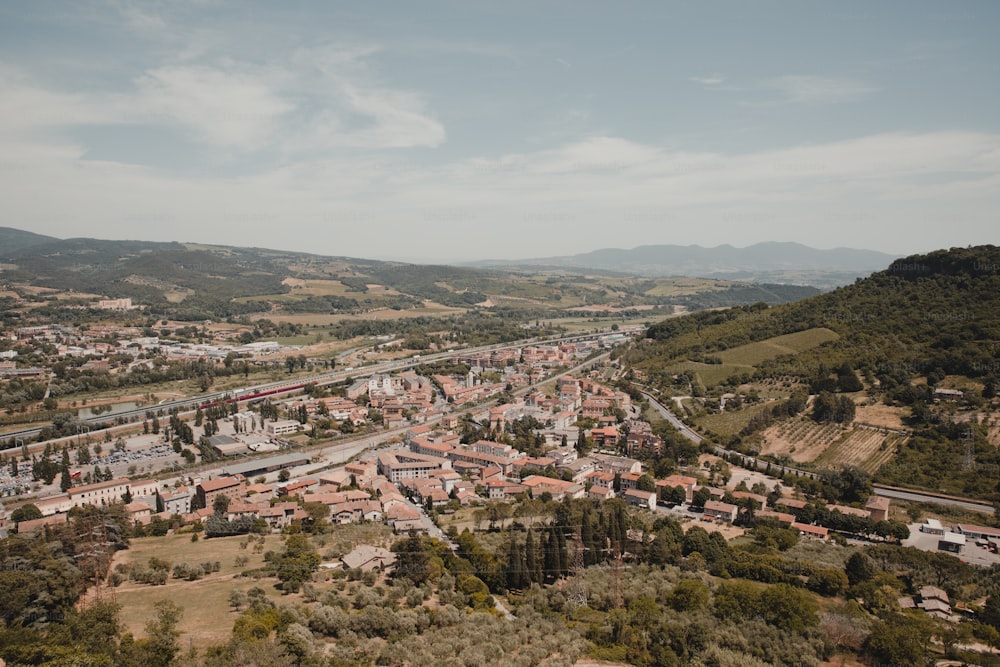 an aerial view of a city in the mountains