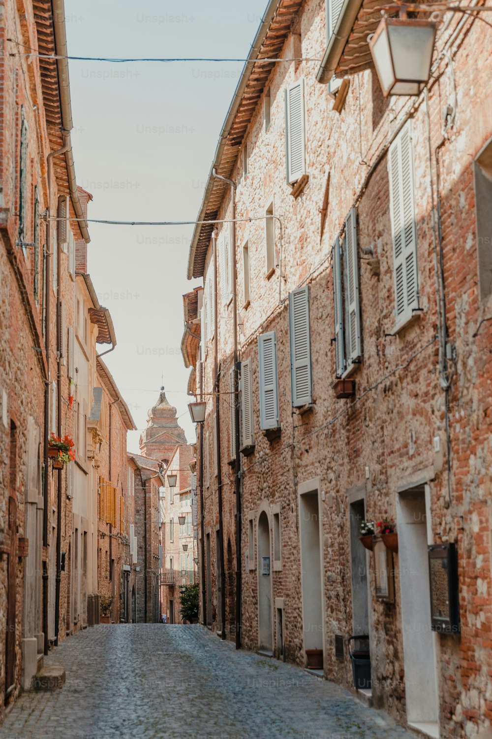 a cobblestone street in an old european town