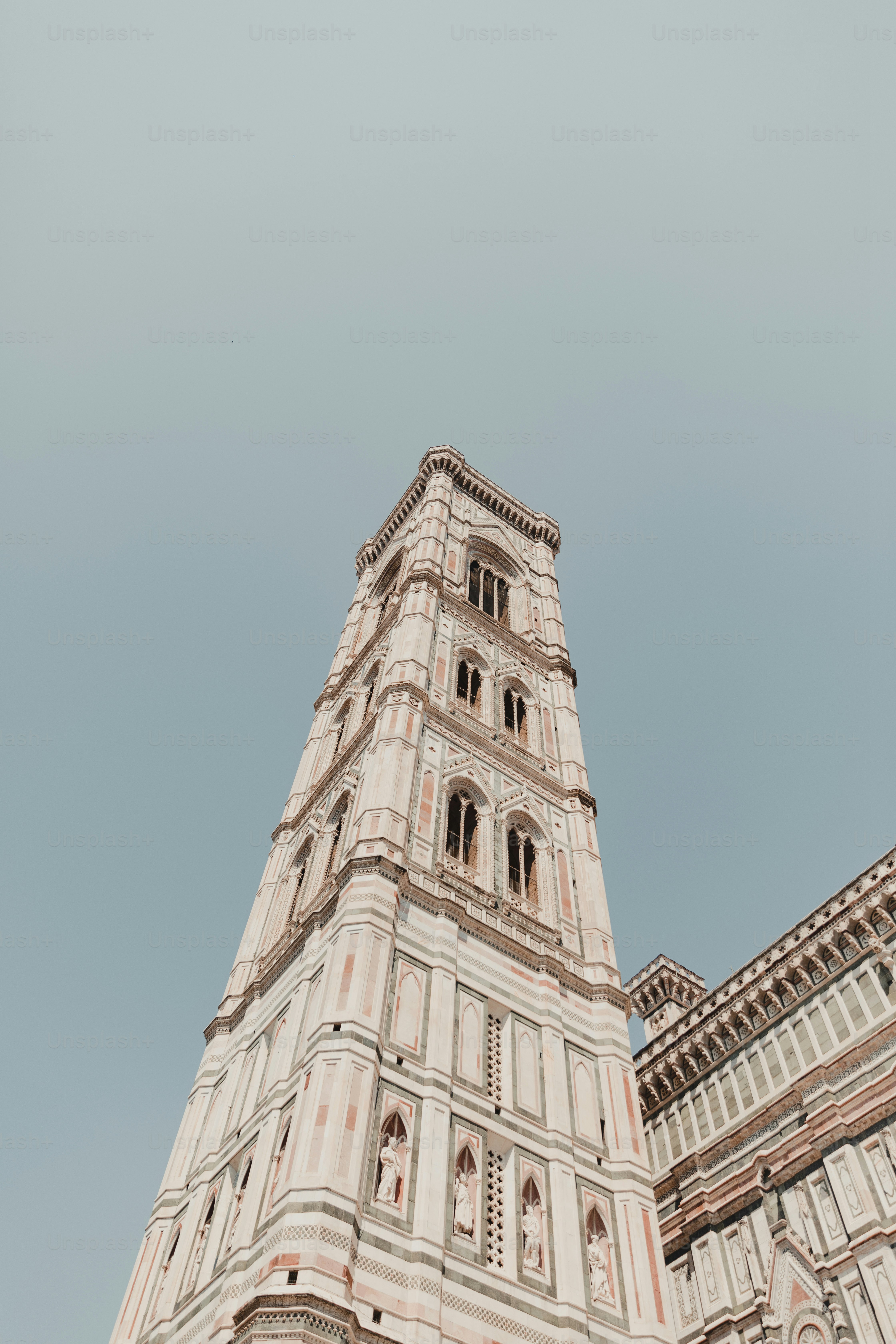 a very tall building with a clock on it's side