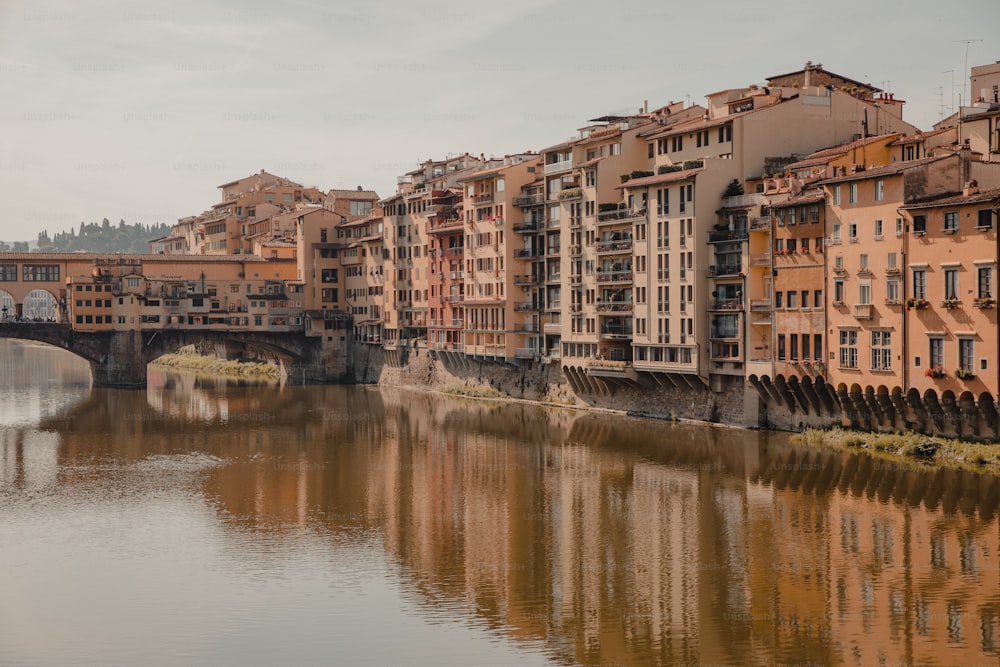 a river running through a city next to tall buildings