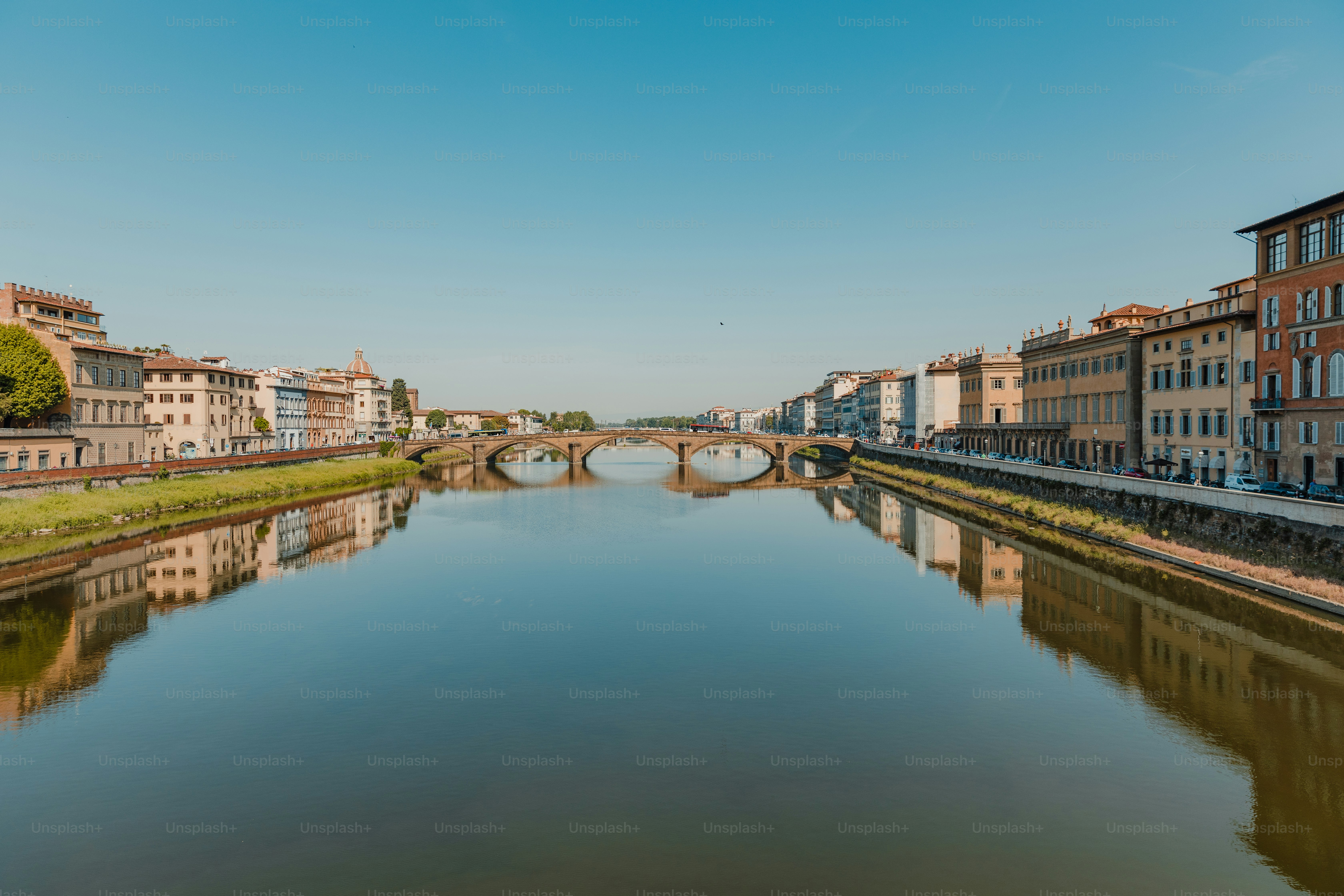 a river running through a city next to tall buildings