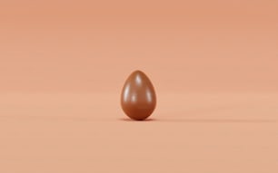 a brown egg sitting on top of a table